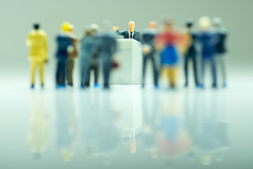 Politician or businessman gives speech to his subordinates.