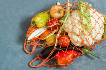String bag with fresh organic vegetables from farm