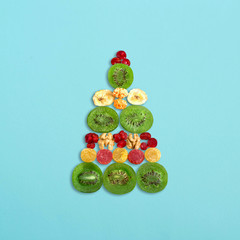 Fototapeta na wymiar Christmas tree of colorful candied fruits and nuts