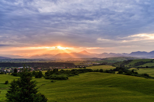 Mountains with last rays of setting sun during a colourful sunset.