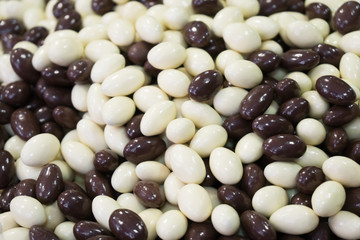 Brown and white chocolate balls in the shop.