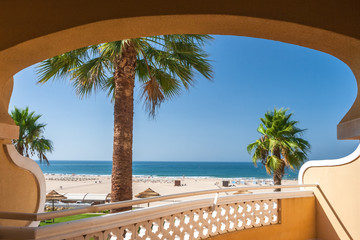 Sea view from a beach hotel room in Portugal. Summer holiday concept