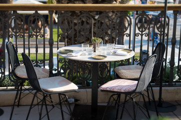 Served table for four persons in restaurant at summer.