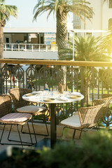 Served table for four persons in restaurant at summer.