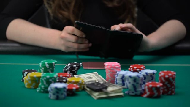 Addicted to gaming woman opening empty wallet, disappointed, money wasting