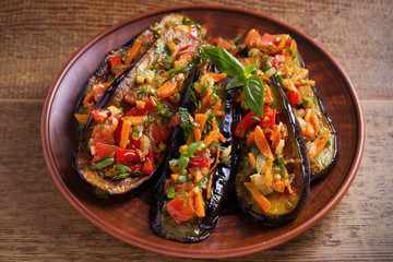 Eggplants with tomatoes, paprika, carrot, onion and garlic. Aubergine with vegetables. overhead, horizontal