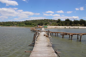  A small provisionally built bridge that leads over a river