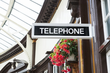 Fototapeta na wymiar Telephone sign in victorian train station at Wemyss Bay in Scotland