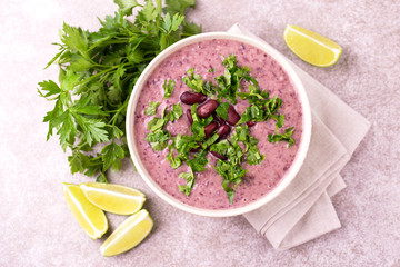 Mexican red bean puree soup with lime, parsley and chilli pepper.