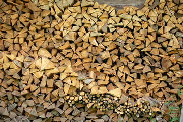 Wall of natural firewood. Stacked Logs Texture.