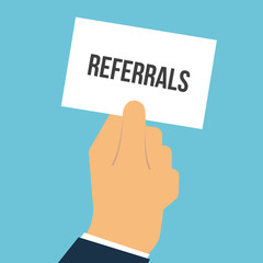 Man showing paper REFERRALS text