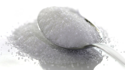 White sugar isolated on white background