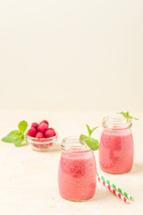 Raspberry smoothie close up photography with fresh summer blended cocktail and ripe berries.