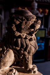 Stone lion in chinese temple