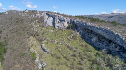 Rock shelter (abri) of Veli Badin is a shallow cave-like opening at the base of a bluff at Sočerga, Istria, Slovenia. Local people have named this rock shelters with 'Ears of Istria'.