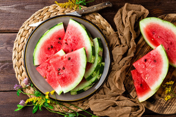Watermelon. Fresh watermelon slices on plate on wooden rustic background