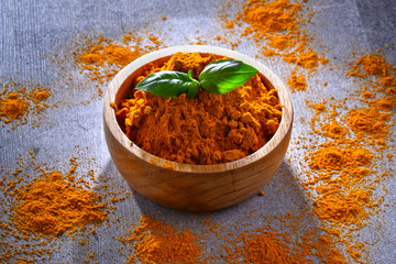 Composition with bowl of turmeric powde