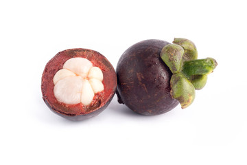 Mangosteen fruit or Garcinia Mangostana and a cross section showing the white inside as a tropical evergreen tree originated from Sunda Island - Indonesia