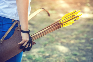 Athlete aiming at a target and shoots an arrow. Archery.
