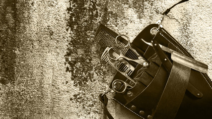 Concept Barber Shop. Set of hairdressing tools an old vintage wall. Toned. Sepia. Copy space Beauty.