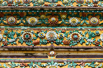 Close up beauitful mosaic tiles of large stupas in Wat Pho or Wat Phra Chetuphon Vimolmangklararm Rajwaramahaviharn is one of Bangkok's oldest temples, THAILAND