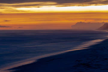 Florida white sand beach sunset after storm long exposure