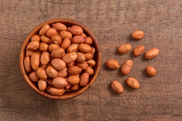 Hazelnuts bowl on wooden background