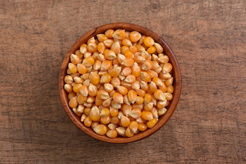 Popcorn seed on wooden background