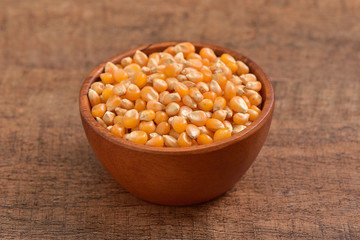 Popcorn seed on wooden background