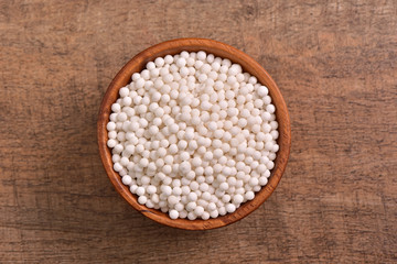 Tapioca pearls bowl on wooden background 