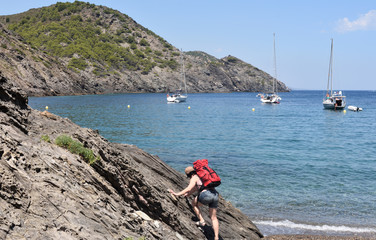 hiker woman in the Cap de Creus on the La Taballera beach, Costa Brava, Girona province, Catalonia,  Spain