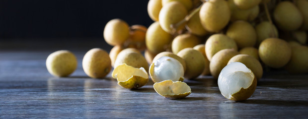 Fresh longan fruit on wooden floor  thai fruit