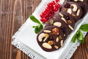 Chocolate snacks with nuts and dried berries