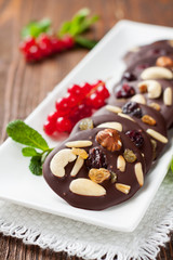 Chocolate snacks with nuts and dried berries