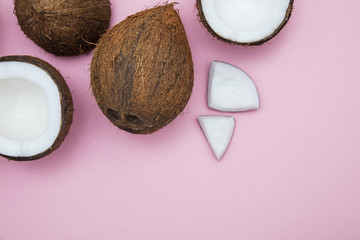 Tropical summer coconut on a pastel pink background.