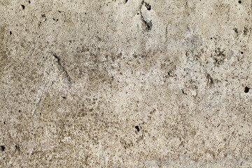 Natural stone surface with drips and dirt. Distressed texture in beige shades.
