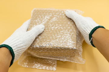 hand man hold bubble wrap, for Packing and protection product cracked or insurance During transit. 
