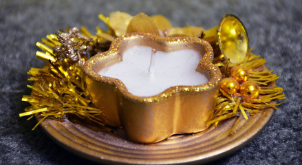 Yellow candle in the form of asterisks. New year