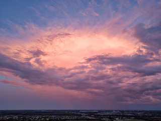 Fototapeta na wymiar Aerial View of Dramatic Rain Clouds at Sunset