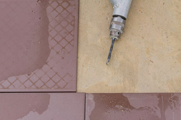 top view of puncher and flooring tiles.
