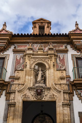 Architectural fragments of Baroque Palacio de la Merced in Cordoba Plaza de Colon. Palacio de la Merced was built in XVIII century; it was monastery of Mercedarian monks. Andalusia, Cordoba, Spain.