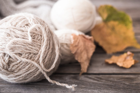 knitting threads with autumn leaves