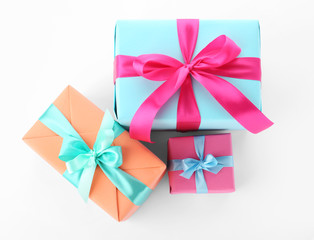 Beautiful gift boxes with ribbons on white background