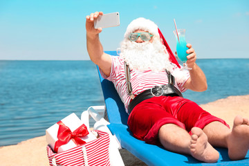 Authentic Santa Claus taking selfie at resort
