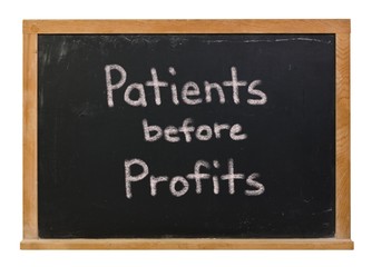 Patients before profits written in white chalk on a black chalkboard isolated on white