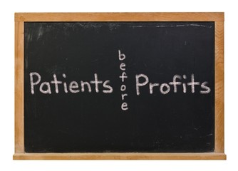 Obraz premium Patients before profits written in white chalk on a black chalkboard isolated on white