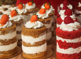 bright mini cakes with cream decoration close up