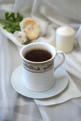 White cup with tea