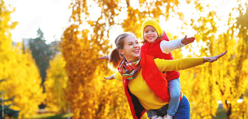 Poster happy family mother and child daughter on autumn walk .