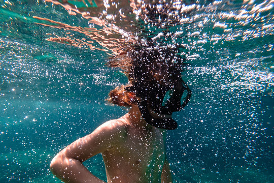 Boy snorkeling in sea